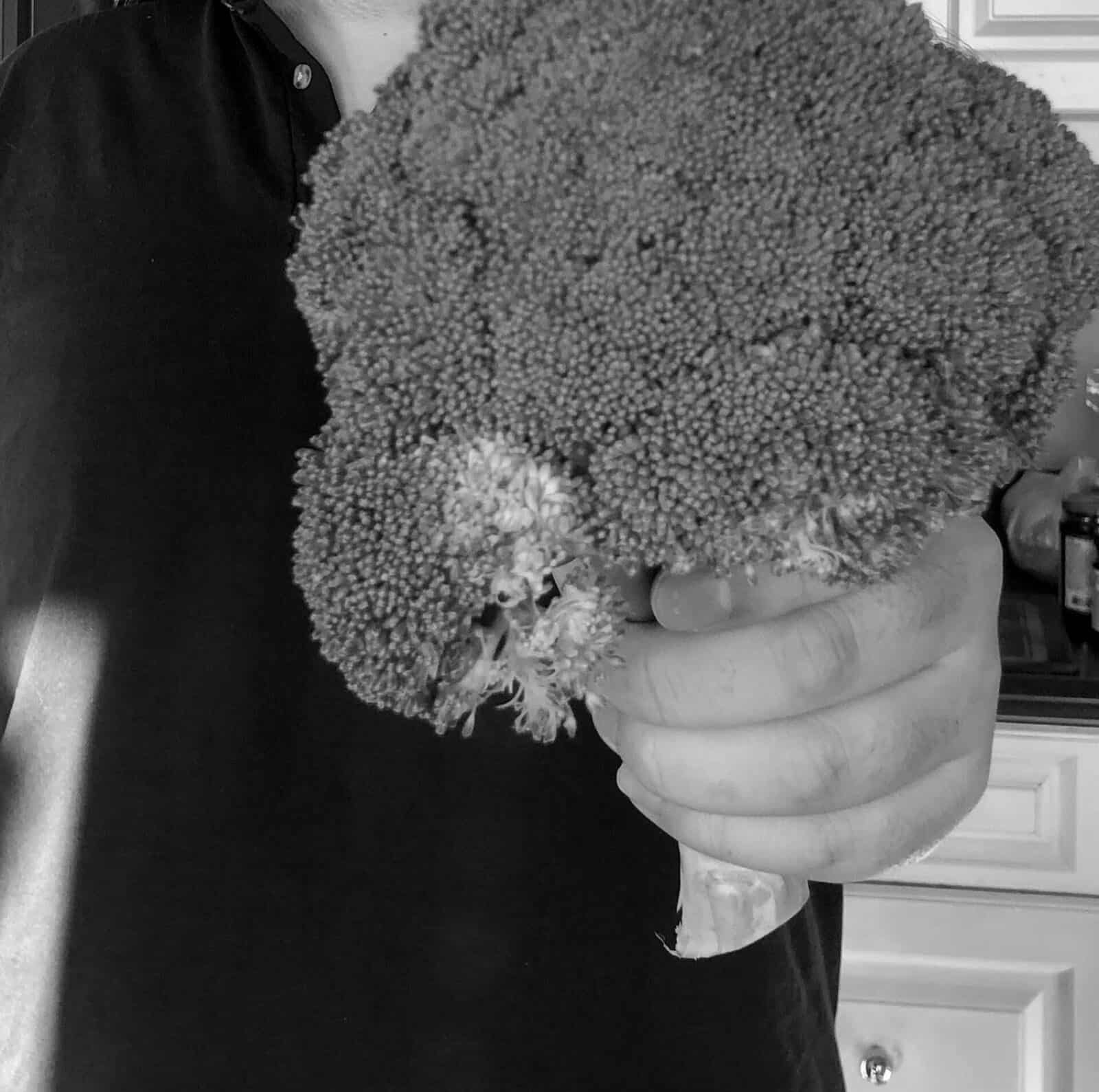 Black and white close-up photo of a head of broccoli.