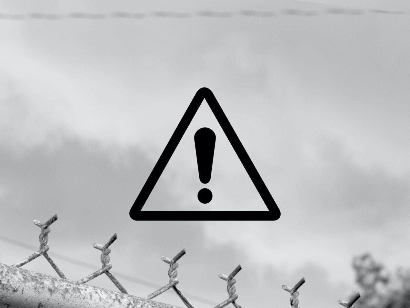 Black and white image of a warning triangle symbol with an exclamation point inside.