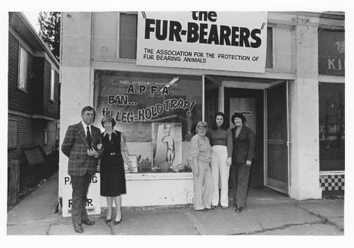 Group of people standing outside The Fur-Bearers office promoting fur animal protection.