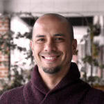 Smiling team member with a friendly expression, representing the compassionate and professional staf.